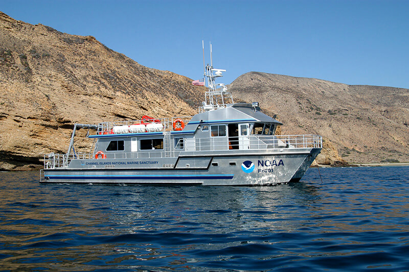 A NOAA research vessel next to Santa Cruz Island